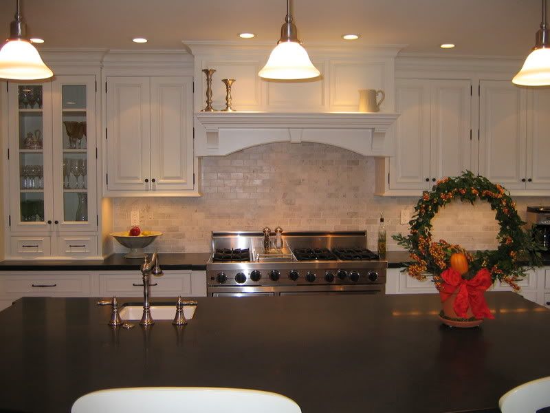 backsplash which is a honed carerra (whites and grays) marble subway tile
