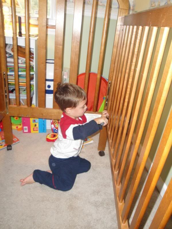 Gavin helping move Carter's crib to Gavin's room